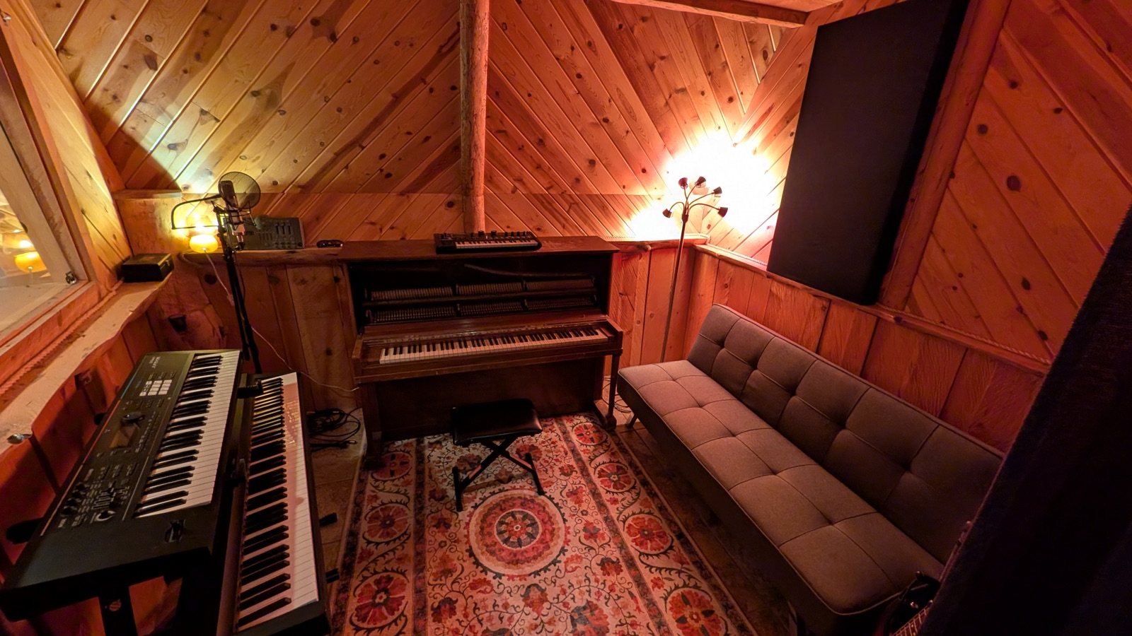 The Sauna, an intimate wood-lined room with an upright piano